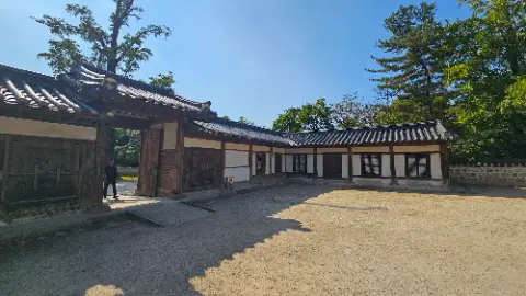A large white building with a red roof