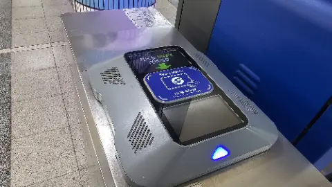 A machine with a blue button on it