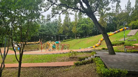 A playground with a slide and a swing