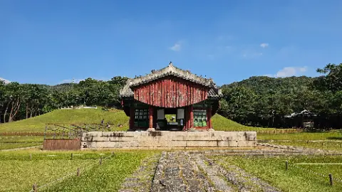 A red and white building with a green roof