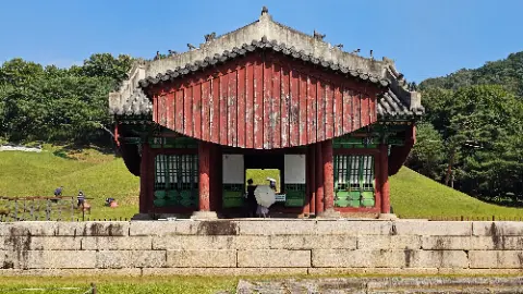 A red and white building with a white roof