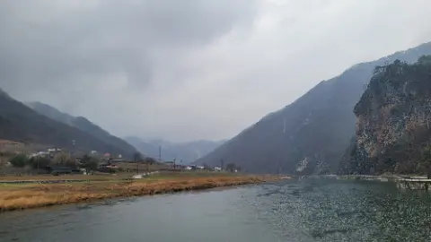 A river with mountains in the background