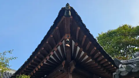 A roof with a bell on it
