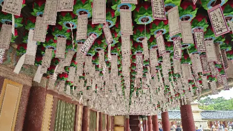 A row of green and red banners hang from the