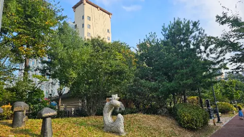 A statue of a dragon is in front of a