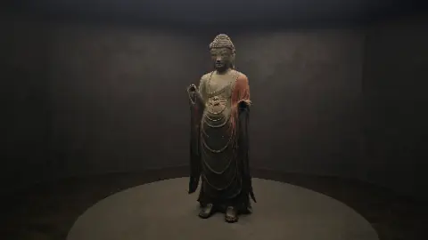 A statue of a person with a hooded robe is