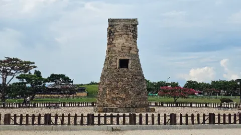 A stone tower with a doorway in the middle