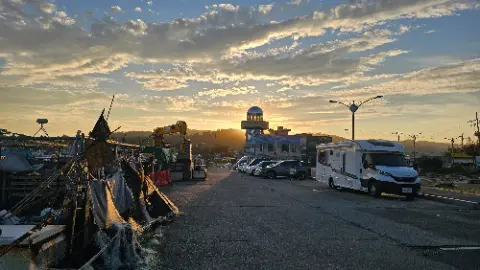 A street with a sunset and a construction site