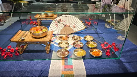 A table with a variety of foods and a fan