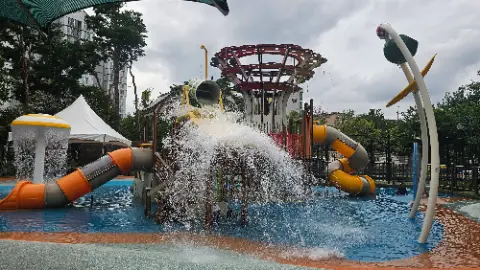 A water slide with a waterfall and a yellow slide