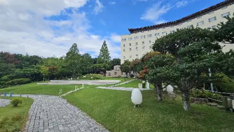A white building with a blue roof and a white